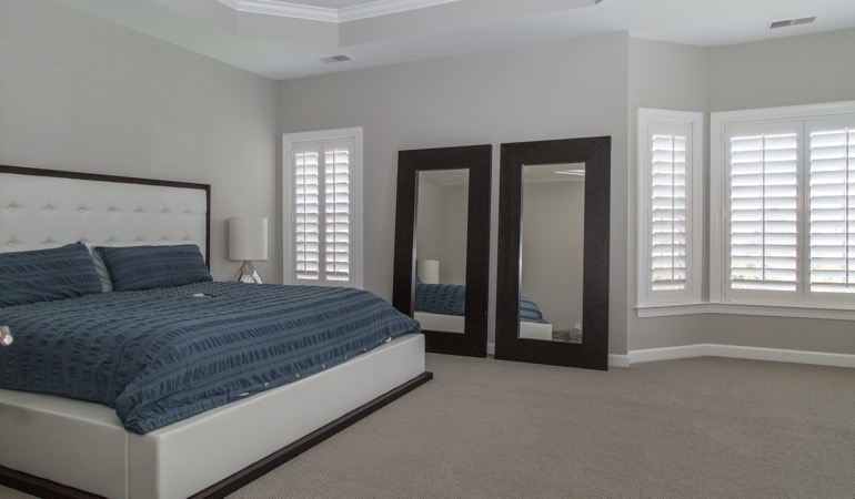 Polywood shutters in a minimalist bedroom in Gainesville.